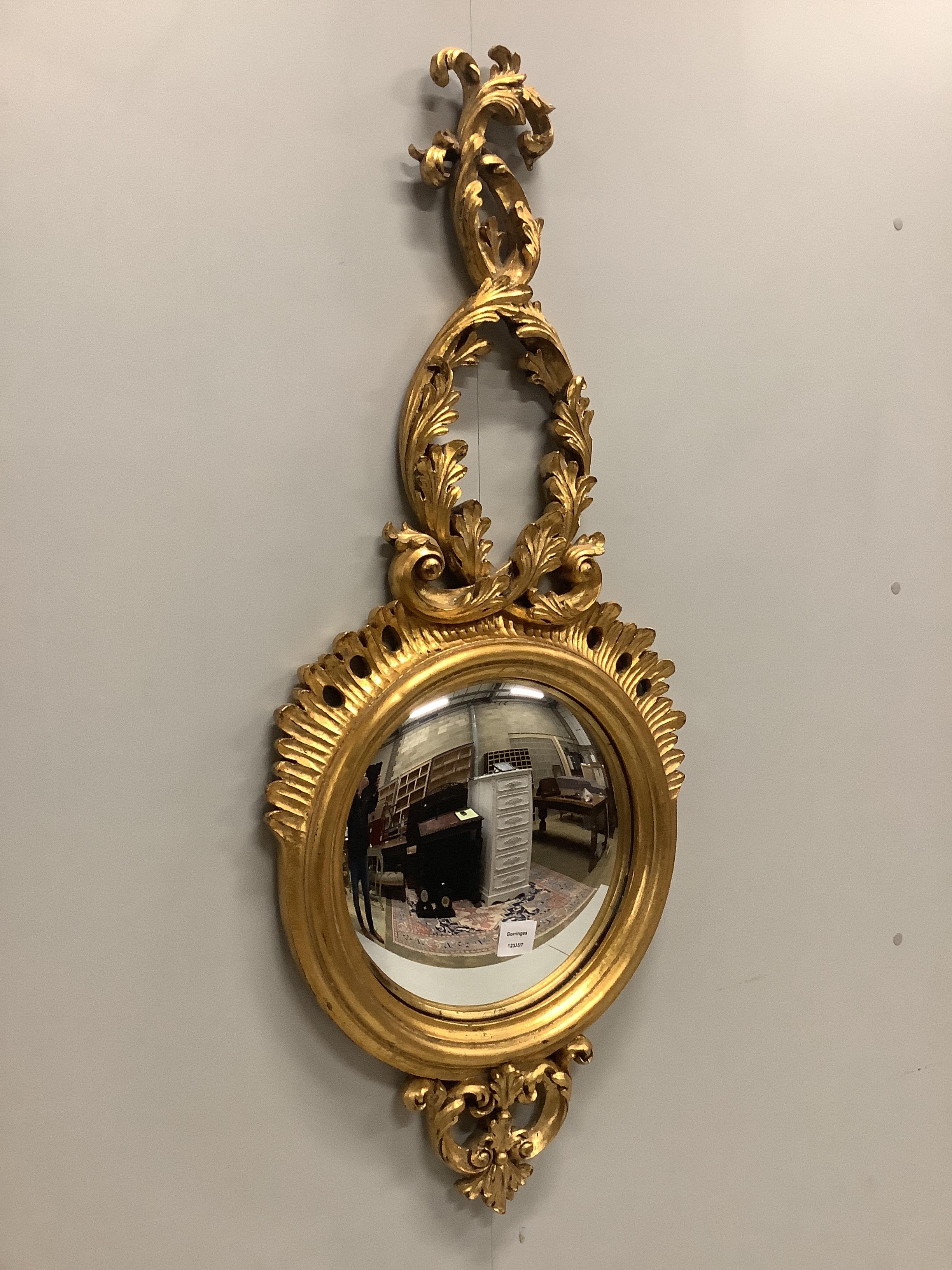 A Regency style gilt framed convex wall mirror, width 46cm, height 110cm